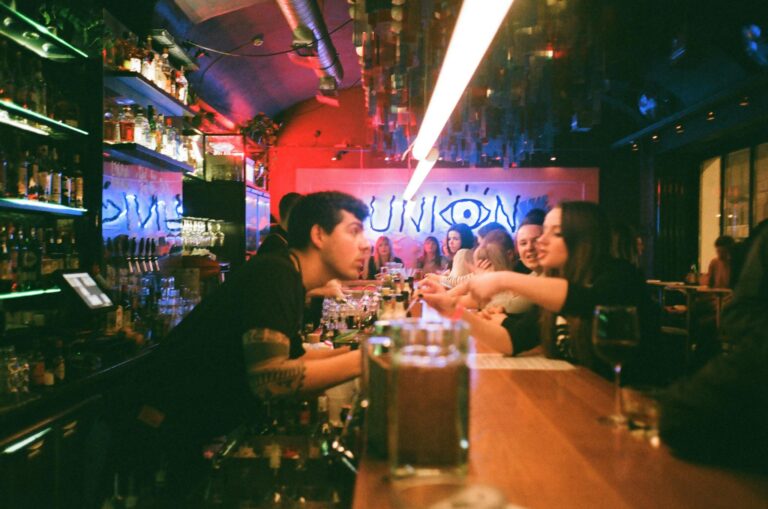 Vibrant nightlife with people enjoying at a modern bar.